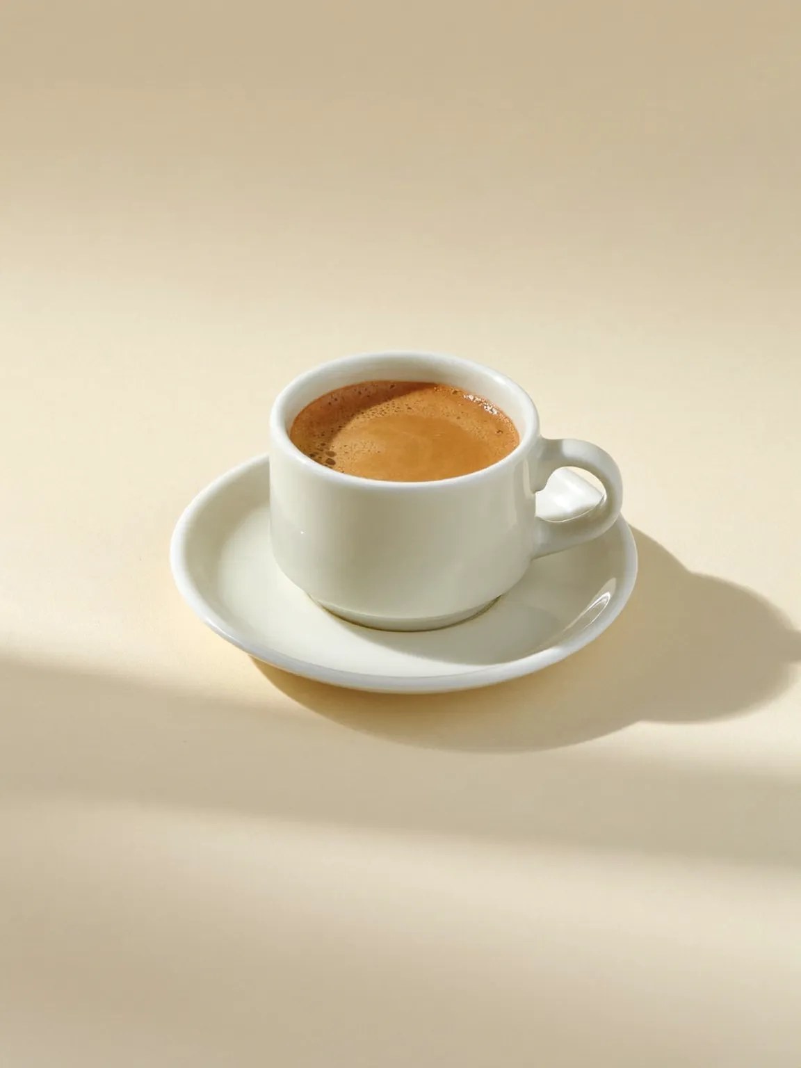 A flat white in a white cup